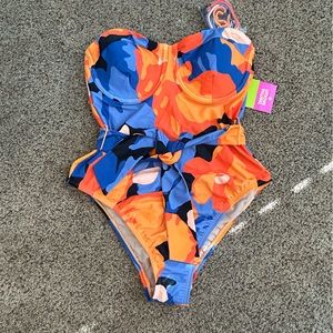 New one piece medium swimsuit with tags. Tabatha brown
